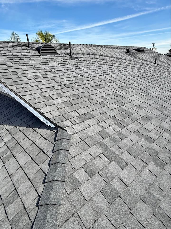 Cleaned gray shingle roof after soft wash roof cleaning